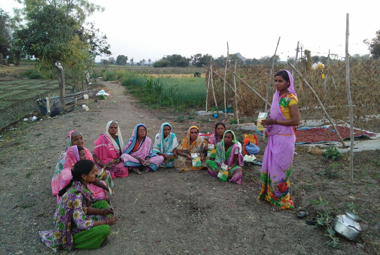 Indian women farmers sitting in a semicircle during a training