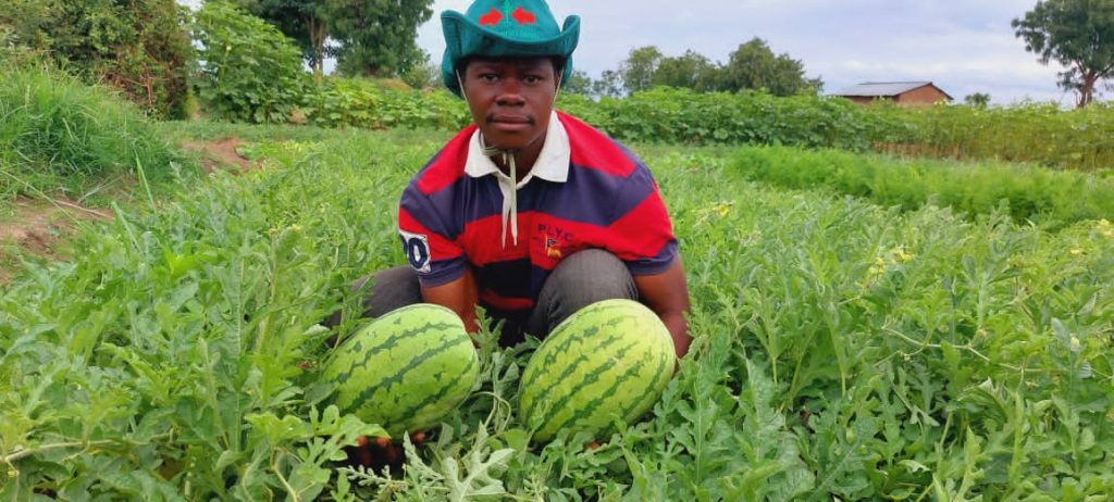 Martin Kisamba, EWS-KT Tanzania Technical Field Officer, with watermelons