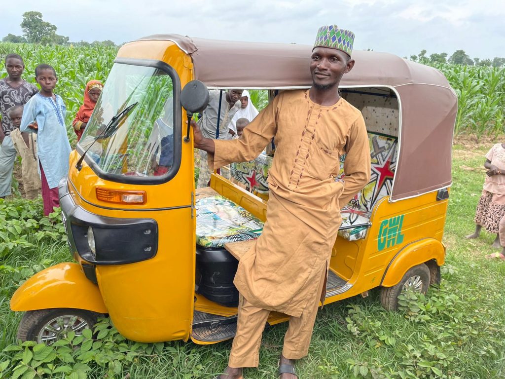 farmer Sani Ibrahim with his auto rickshaw