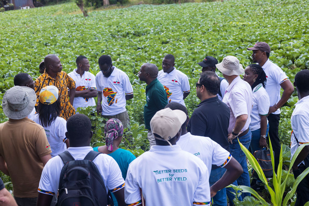 Visitors speak with farmer Ataah Awuni
