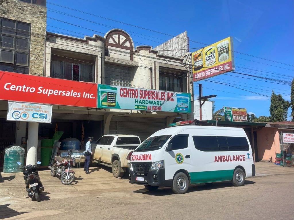 An ambulance sits in front of Centro Supersales to pick up fresh vegetables for the hospital
