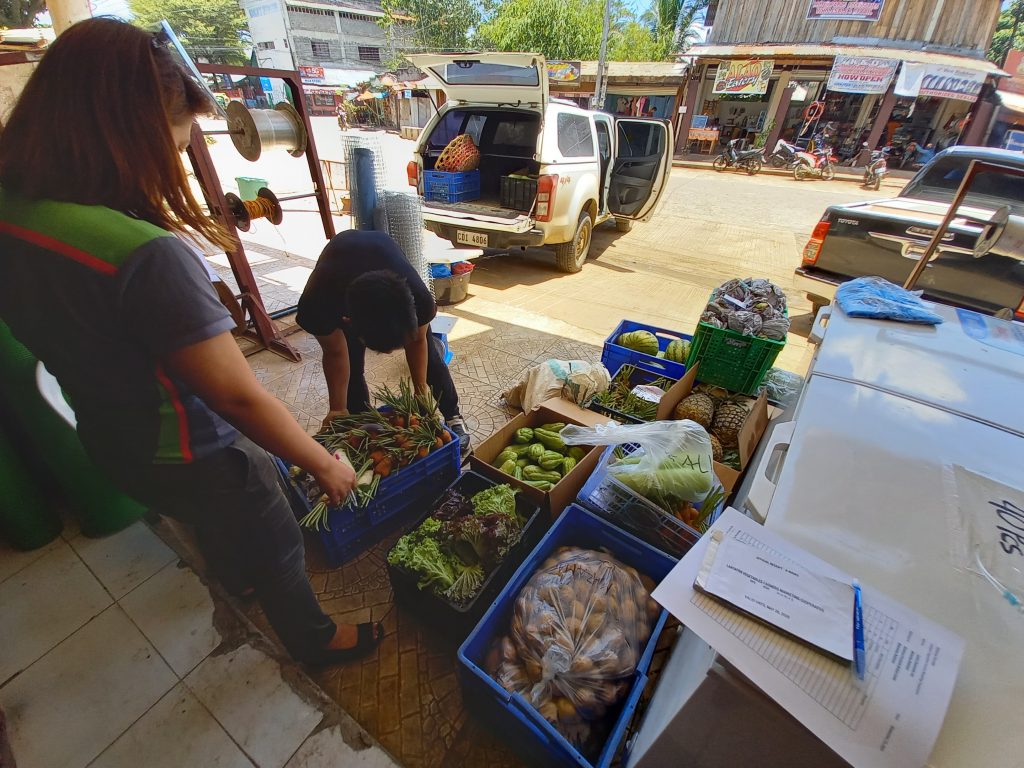 Farmers from the Pangantucan group delivering vegetables to Centro Supersales for Bukidnon provincial hospitals