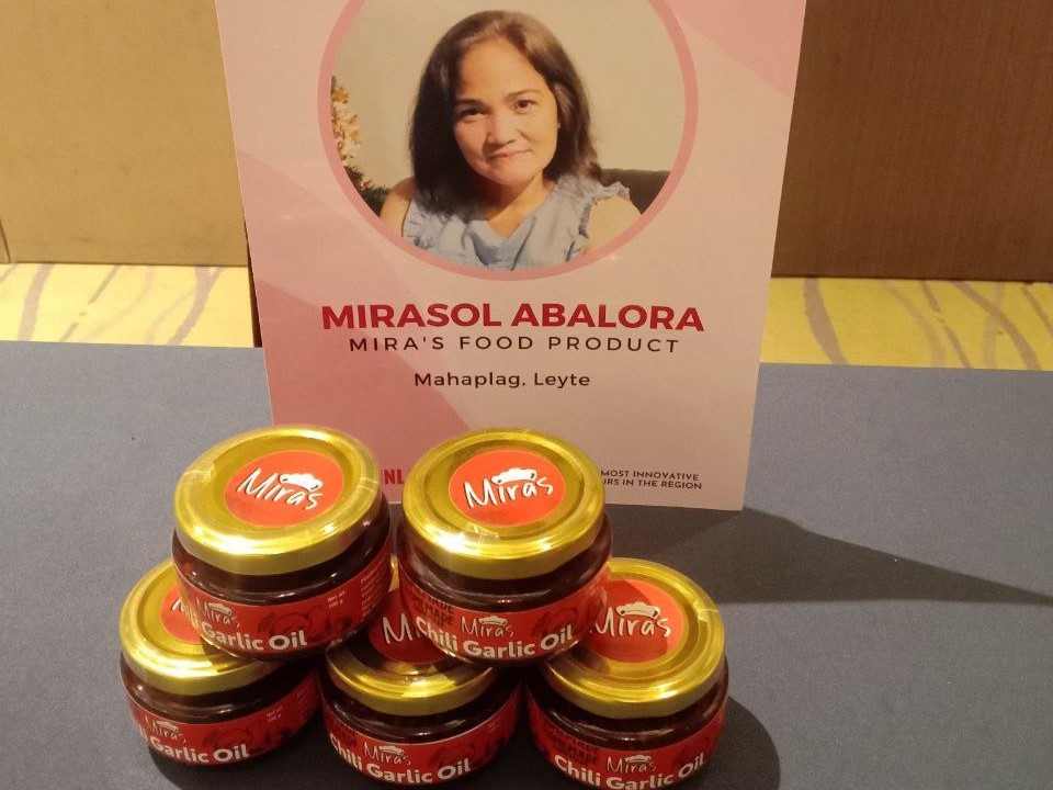 A display of five jars of Mirasol Abalora's chili garlic oil.