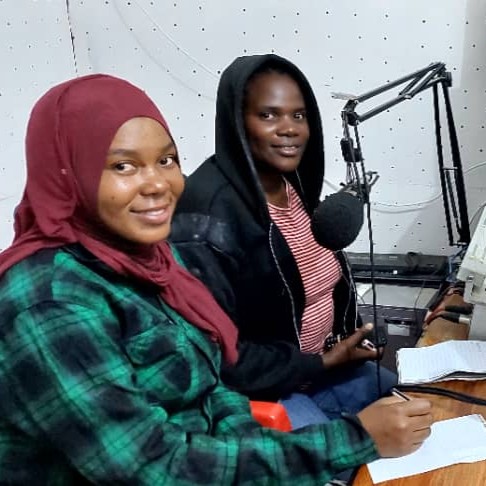 EWS-KT Technical Field Officers Hadija Lihumbo and Lydia Mkopa during a radio session.