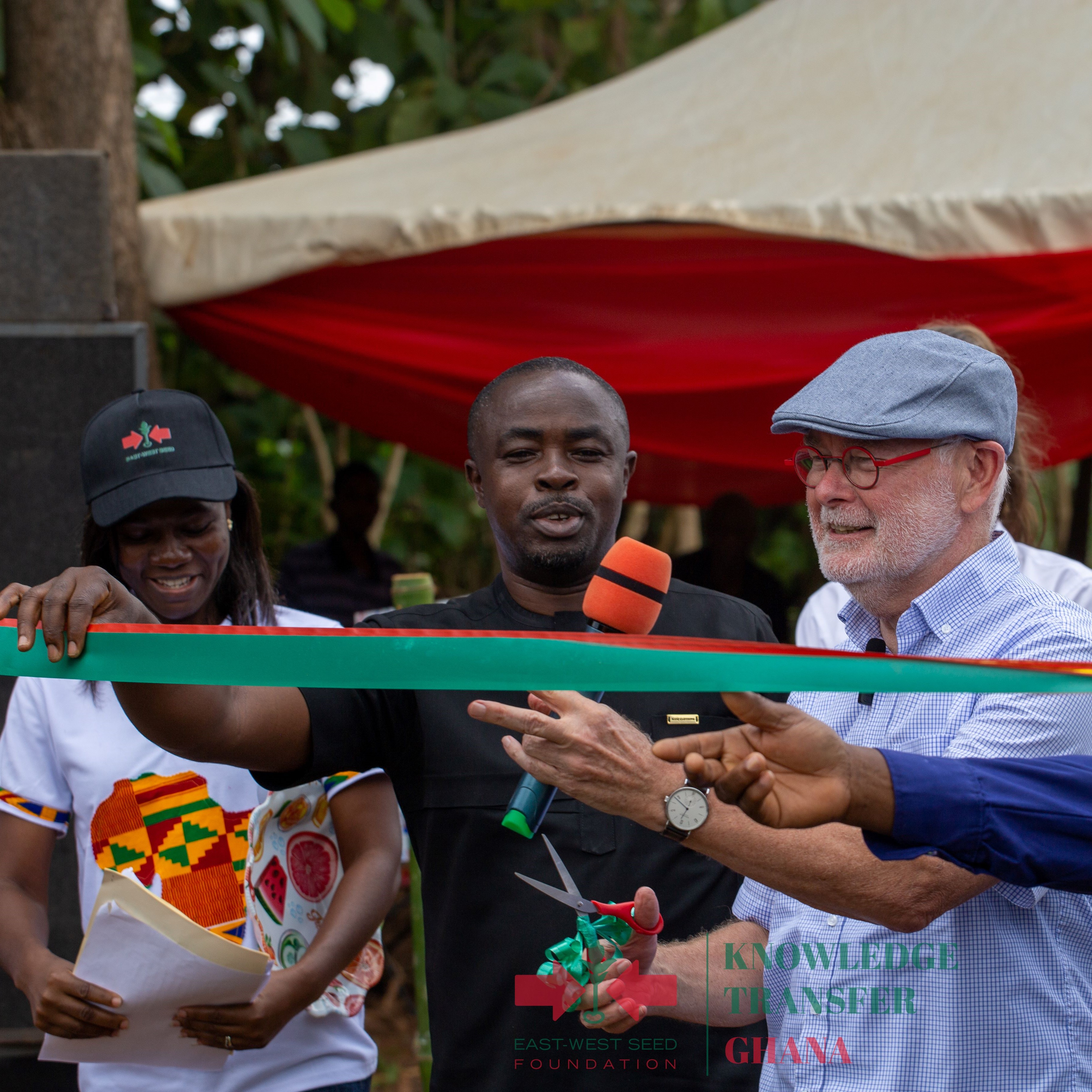 H.E. Jeroen Verheul (center), Ambassador of the Netherlands Embassy to Ghana, prepares to cut the ribbon for the opening of the Ghana learning farm as Jemima Djah, EWS-KT Knowledge Transfer Manager for Ghana and Ansu Kumi, Municipal Chief Executive for the Sunyani Municipal Assembly look on.