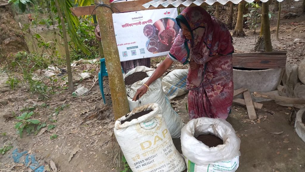 Amena Begum with bags of harvested vermicompost.