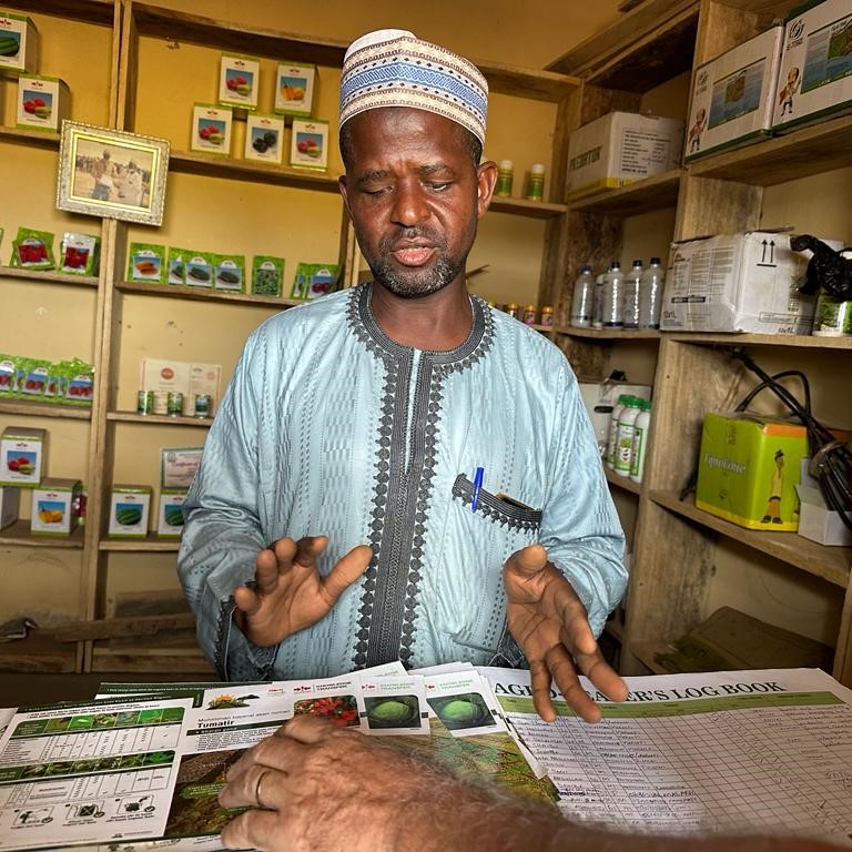 Sani Umar stands in his agro-input shop.
