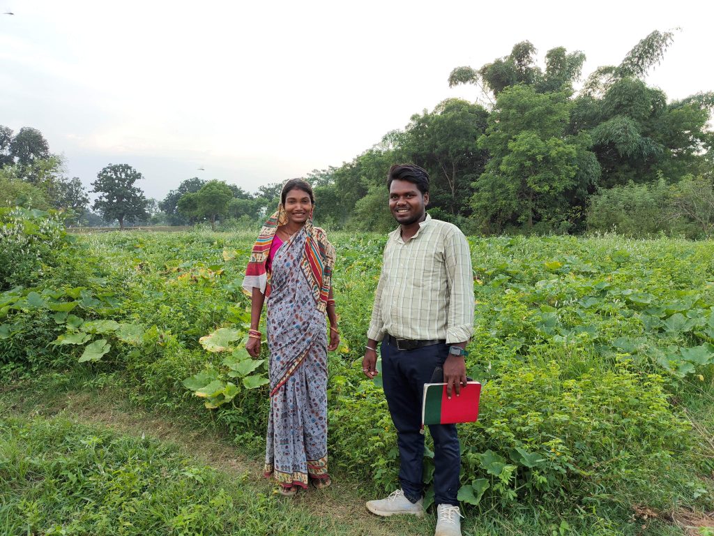 Pumpkin farmer Raibari Behera and EWS-KT Technical Field Officer Sanu Kumar Behera.