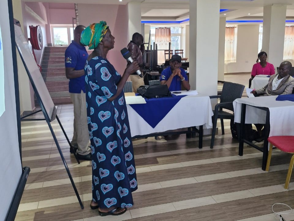 Farmer Flora Akulu speaking at the farmer certification event.