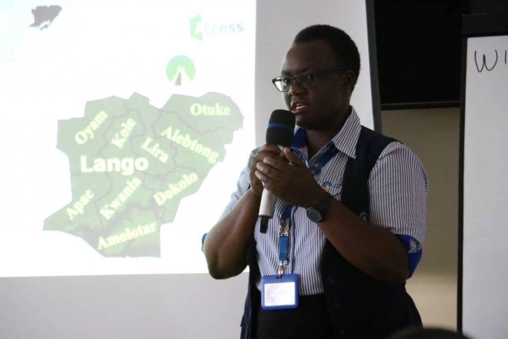 Centenary Bank Credit Administrator Apio Polline speaking at the farmer certification event.