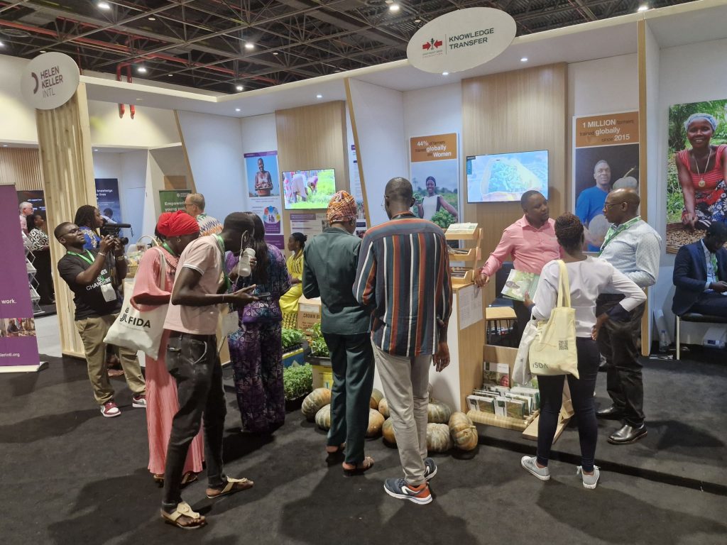 Visitors around the East-West Seed Knowledge Foundation booth at the Africa Food Systems Forum 2025.