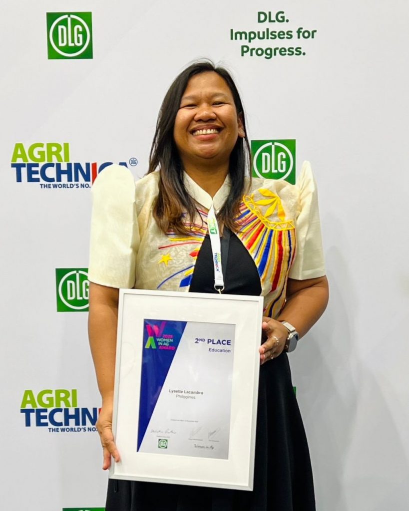 Lysette Lacambra holds her 2025 Women in Ag Award at the award ceremony.