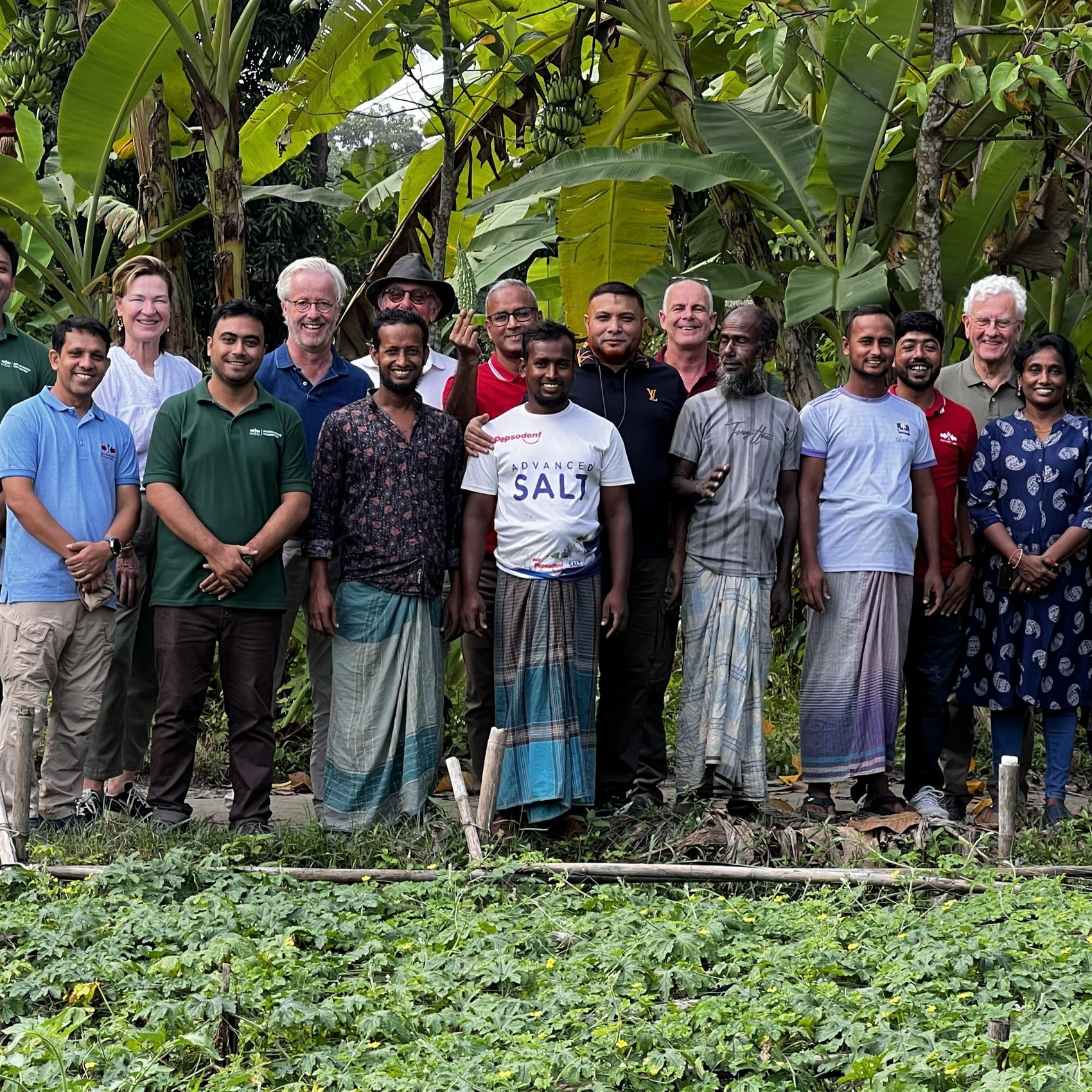 The 4-member EWS-KT Board of Trustees with staff and farmers.