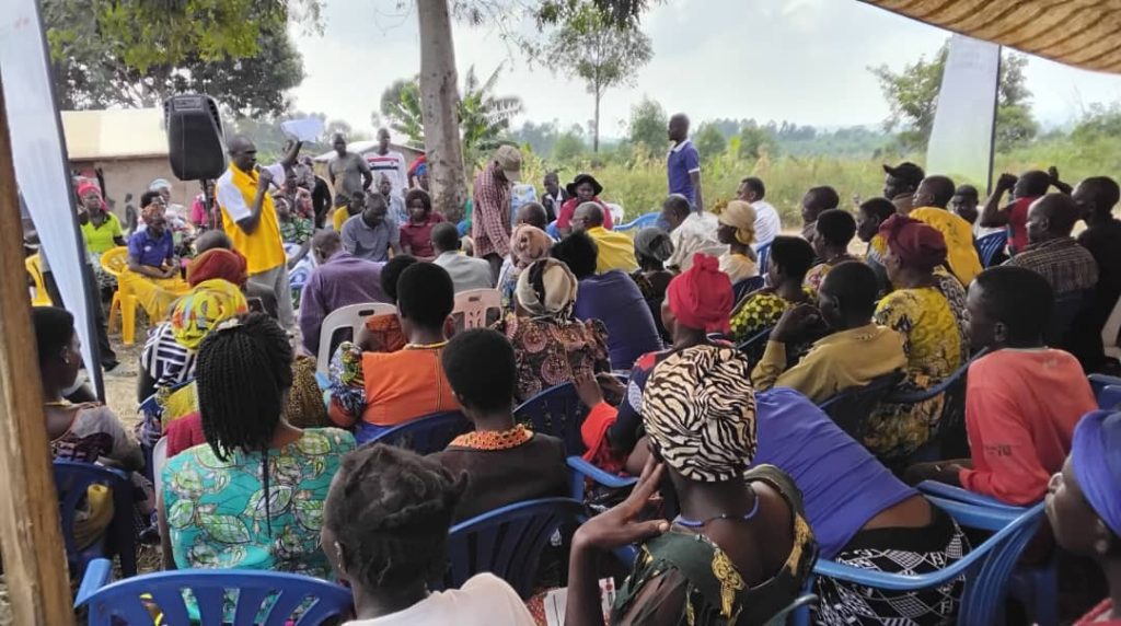 A portion of the crowd seated at the Farmers Field Day event to celebrate pumpkin-producing youth groups.