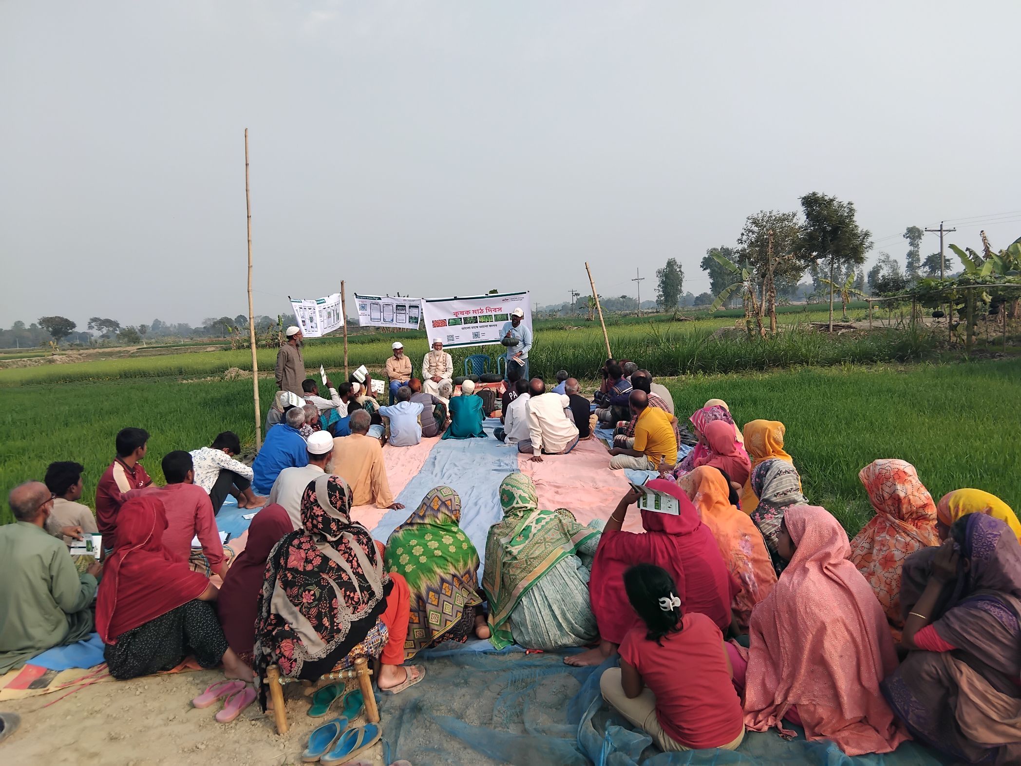 Men and women gathered for a group training in Bangladesh.