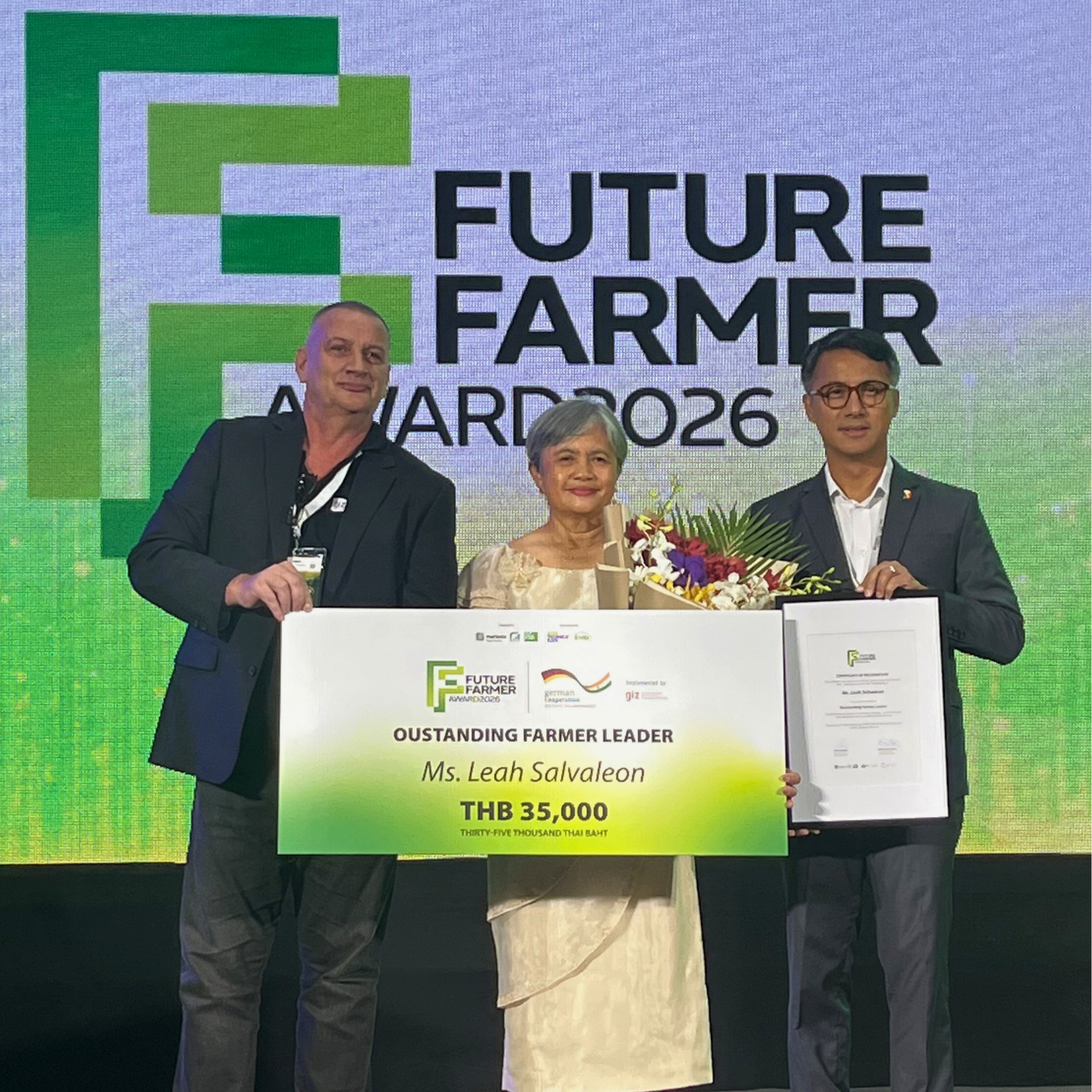 Farmer Leah Salvaleon with two men displaying her Future Farmer Award.
