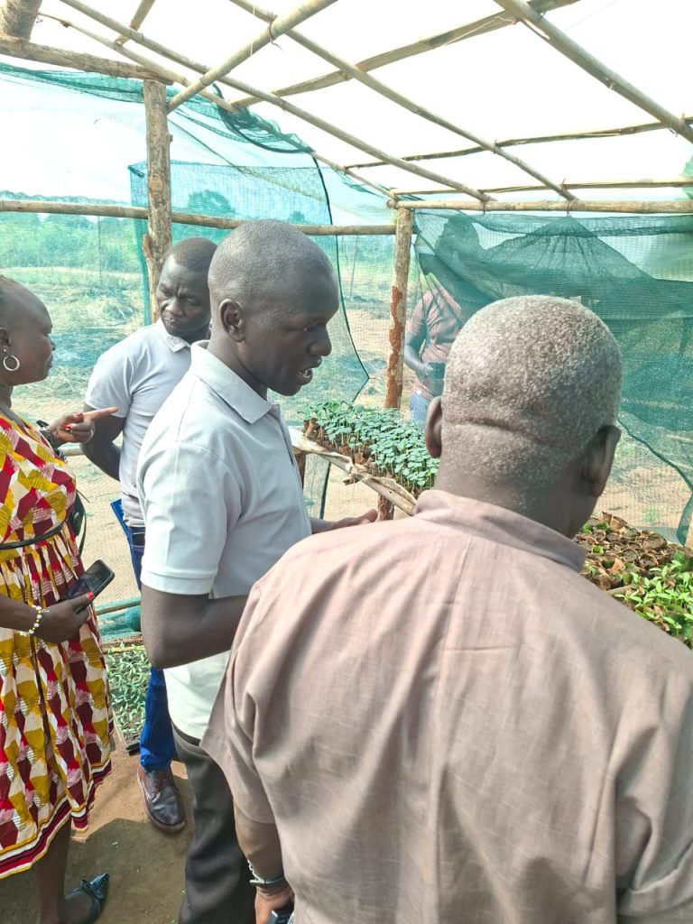 Eastern Equatoria State Ministers Margaret Idwa Okuye and Ochola Bosco Oringa visit the covered seedling nursery at the learning farm in Torit County, Eastern Equatoria State, South Sudan.